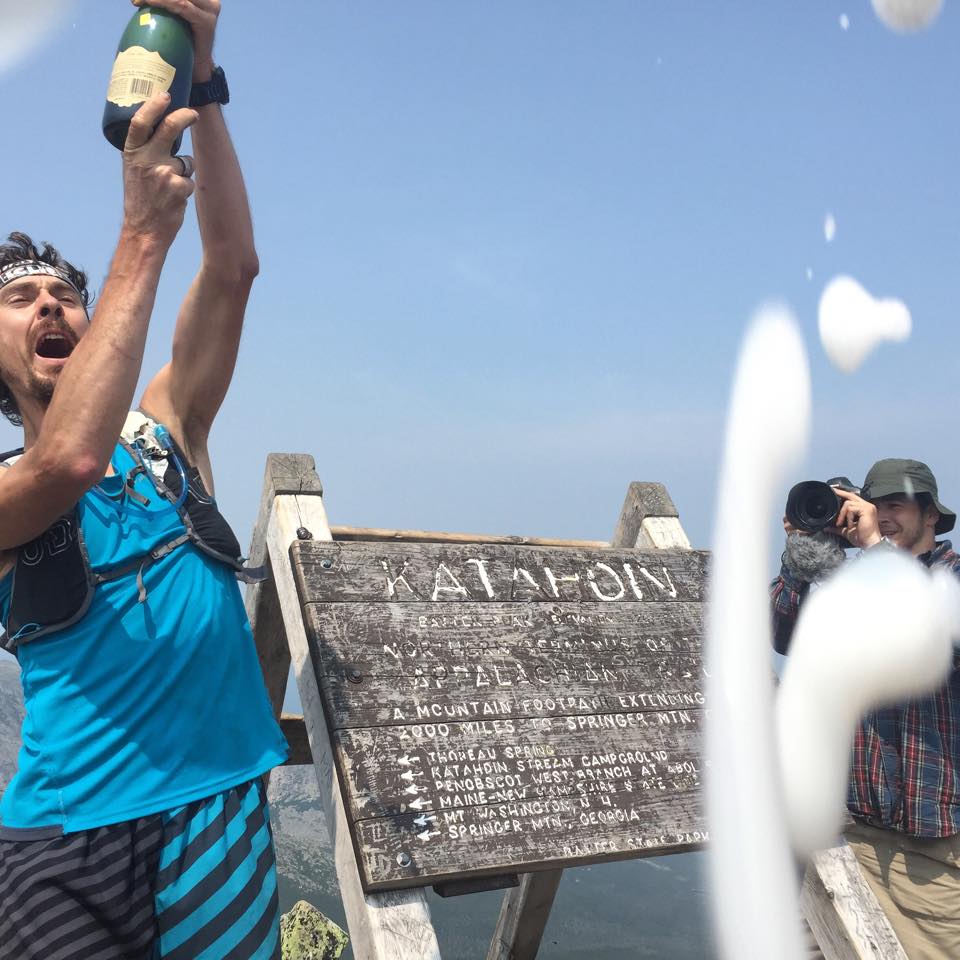 Ultrarunner Scott Jurek celebrates atop Katahdin after completing the Appalachian Trail in record time. (Scott Jurek Facebook Photo)