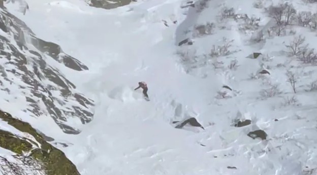 A snowboarder escapes an avalanche in Tuckerman Ravine on Mount Washington. (Mount Washington Avalanche Center Photo)